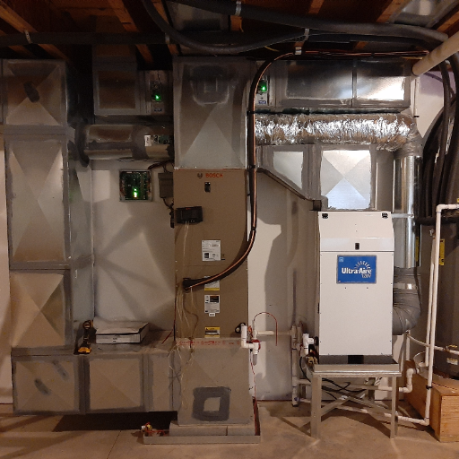 How do I integrate a ducted dehumidifier with my existing HVAC system?
