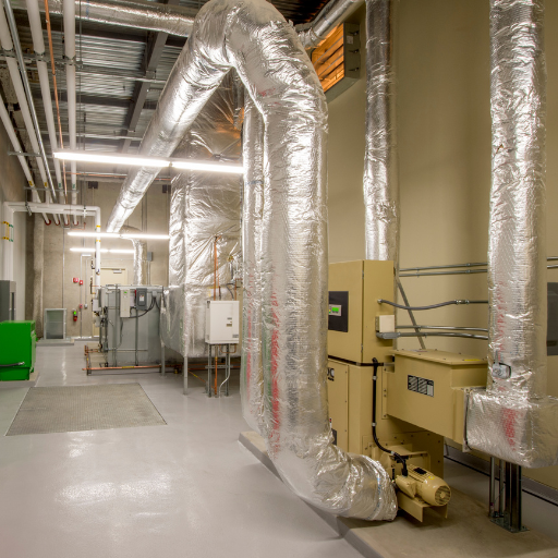 How do you install a whole-house dehumidifier in an existing HVAC system