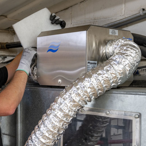 What are common challenges when ducting a dehumidifier, and how can they be overcome?