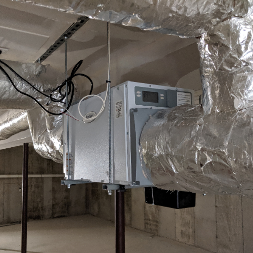 What are the steps to install a whole-house dehumidifier in your existing ductwork?