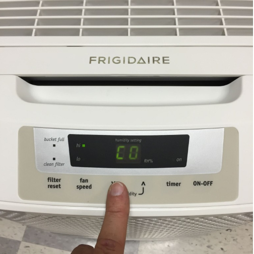 When should I adjust my basement dehumidifier settings?